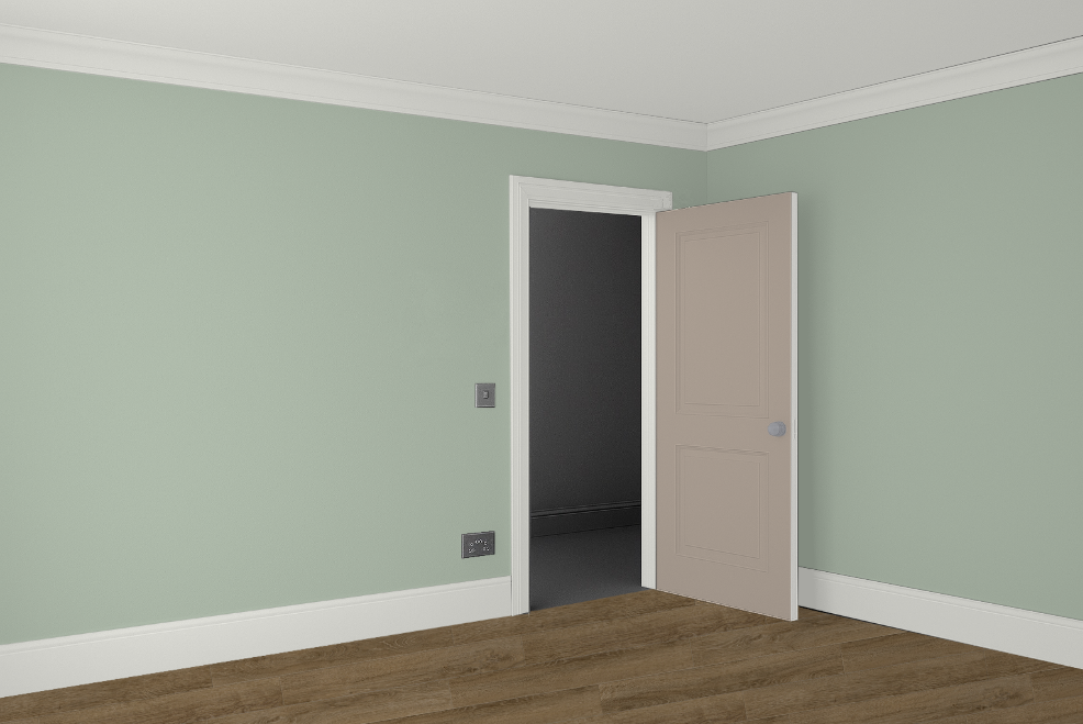 An interior compliant to the UK's visual contrast requirements. the walls are a pale green, contrasting to a walnut floor. The door and trims also have adequate contrast.