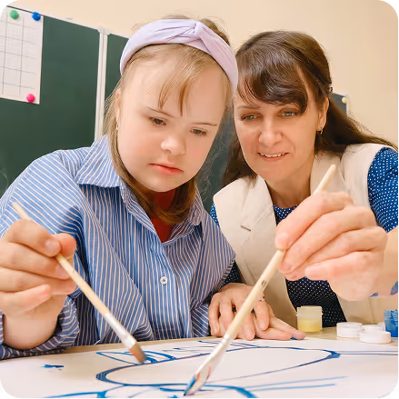 Instructor teaching children with developmental disabilities through creative learning