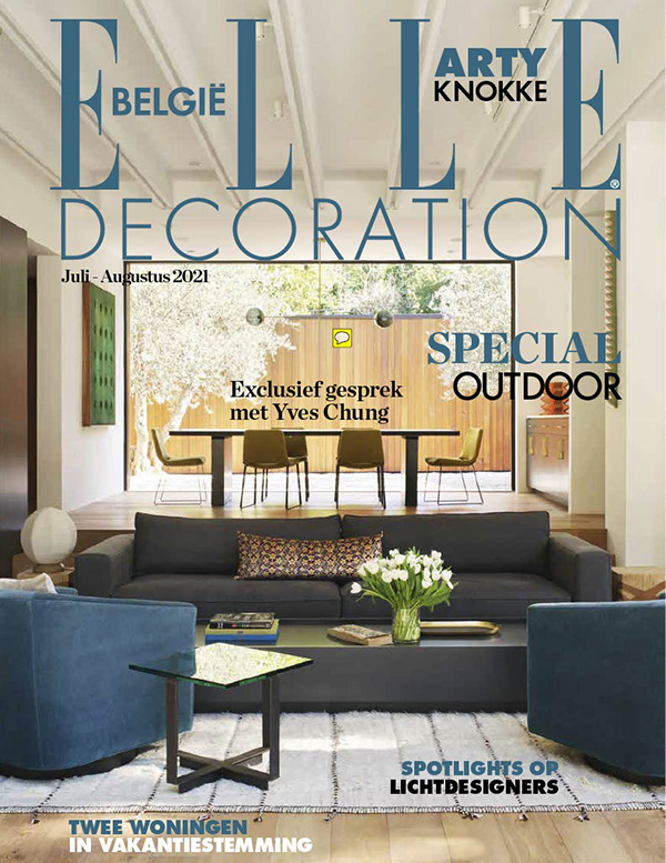 Magazine cover of ELLE Decoration Belgium showing a bright modern living room