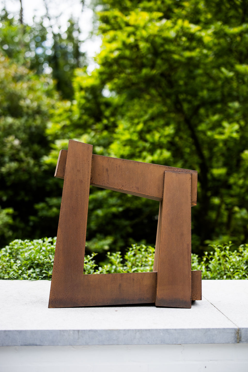 Large Corten steel sculpture by renowned French artist Delphine Brabant, designed to enhance outdoor spaces.