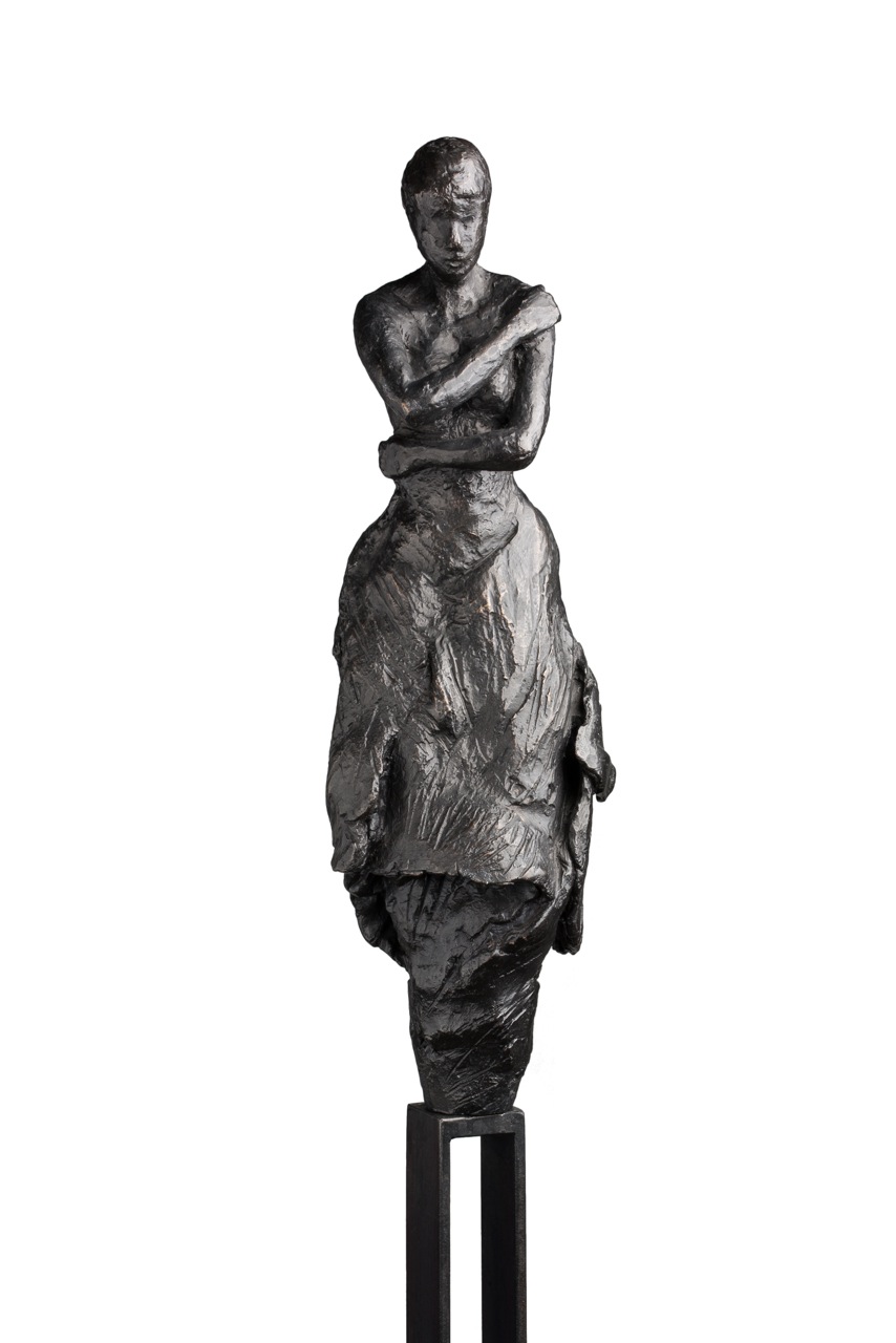 Bronze garden sculpture of a woman by belgian artist Anne De Mol.