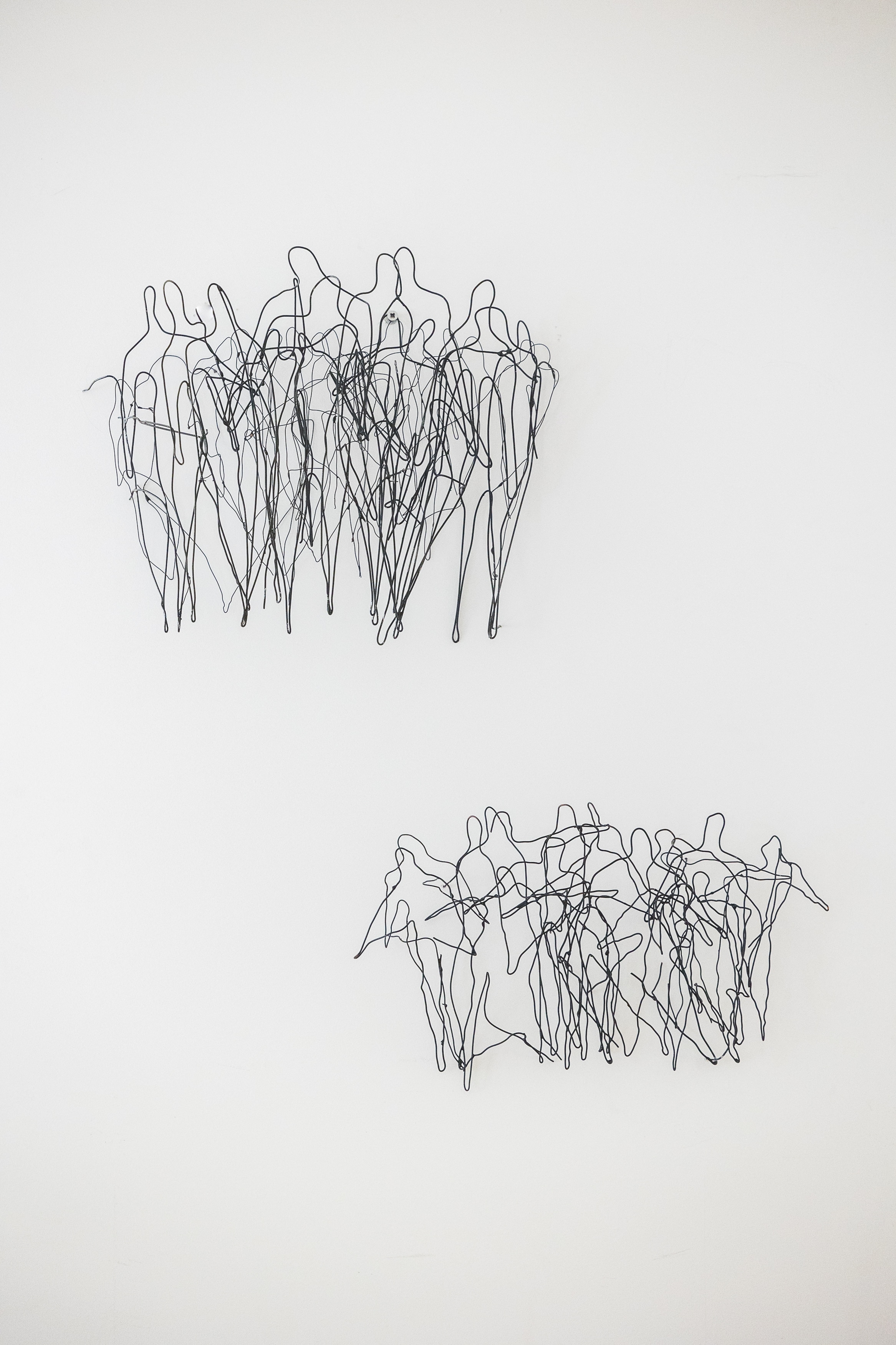 Mural figurative wire sculpture of a group of people. Sculpture made by belgian artist Anne De Mol. One of a kind.