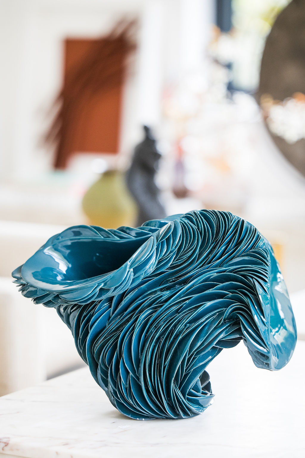 A one-of-a-kind ceramic vase featuring layered blue and green glazes, handcrafted by French artist Lorène Cavagna. Its organic form and painterly surface make it a striking decorative piece, whether displayed alone or with dried flowers.