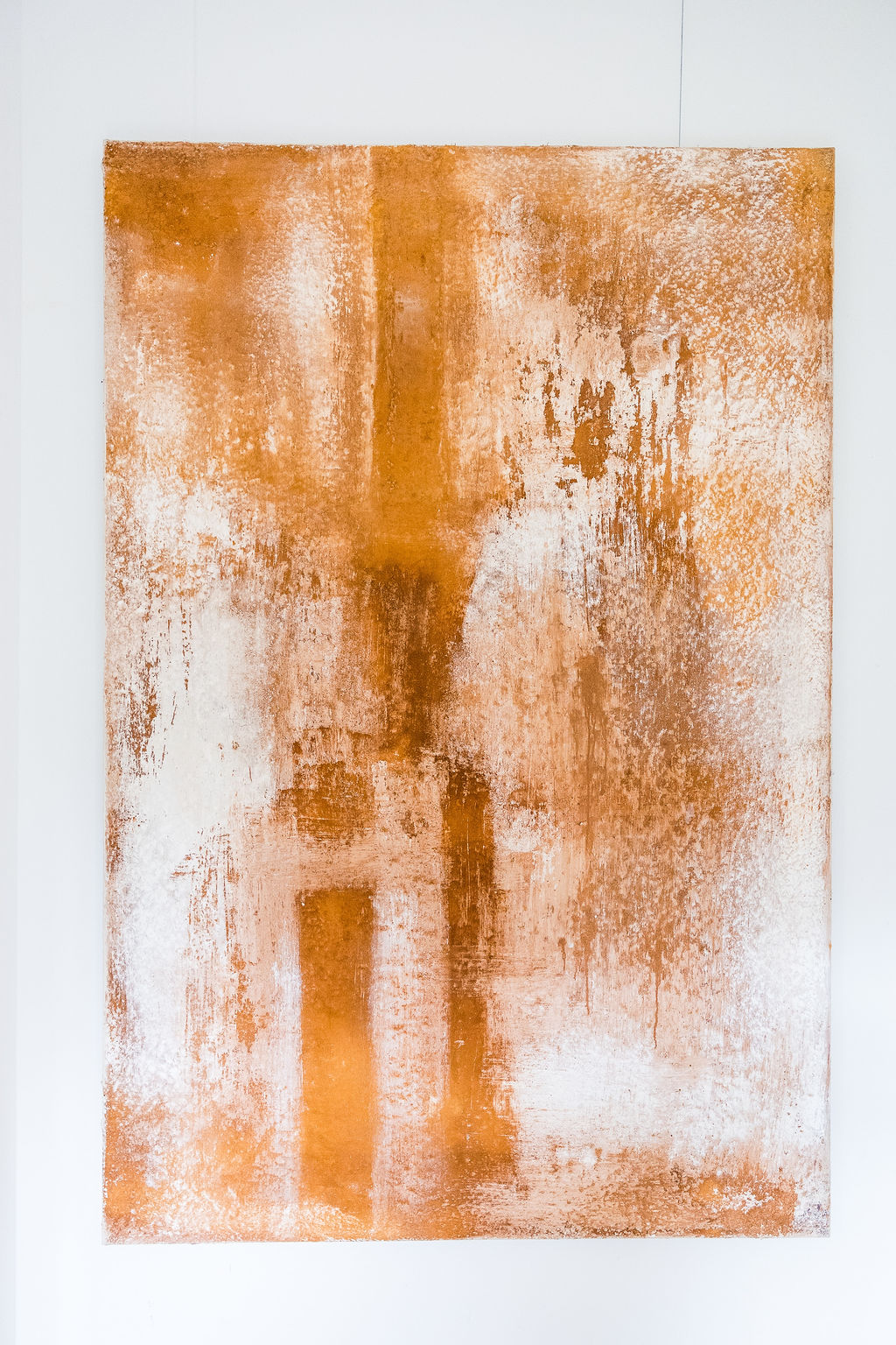 A powerful abstract composition rendered in rich earth tones using raw pigments, created by Belgian artist Catherine van Pottelsberghe. This one-of-a-kind painting explores texture, depth, and mineral color, evoking landscapes, matter, and elemental