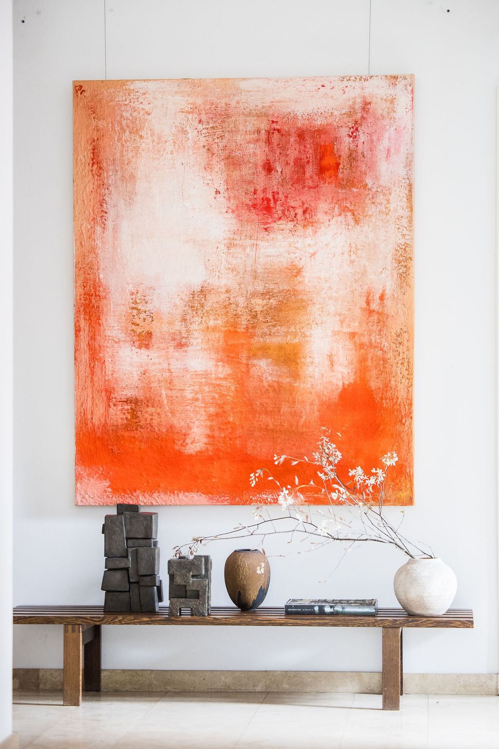 A powerful abstract composition rendered in rich orange tones using raw pigments, created by Belgian artist Catherine van Pottelsberghe. This one-of-a-kind painting explores texture, depth, and mineral color, evoking landscapes, matter, and elemental