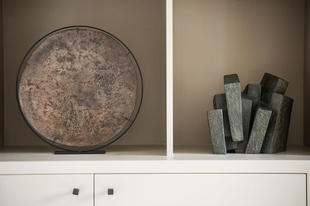 Small petal brown sculpture by belgian artist Delphine Ricour made of powder marble on linen and presented on a steel structure.