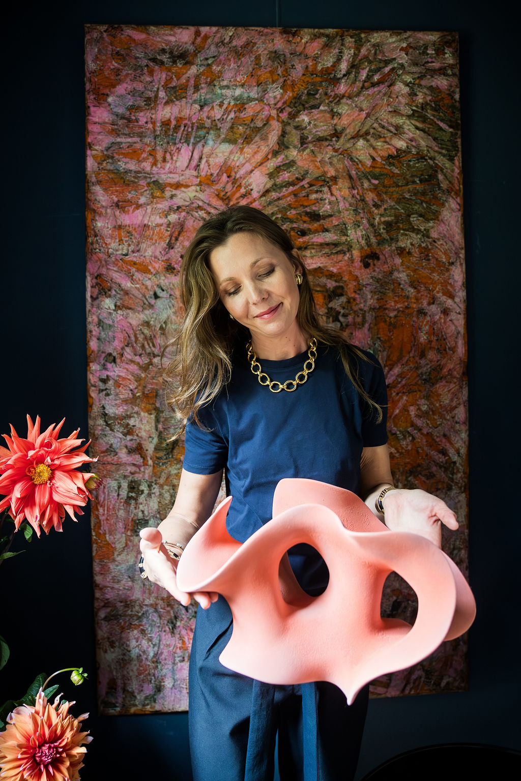 Collector-style presentation of a pink ceramic sculpture by Belgian artist Liliane Demeester, highlighting its sculptural openings.