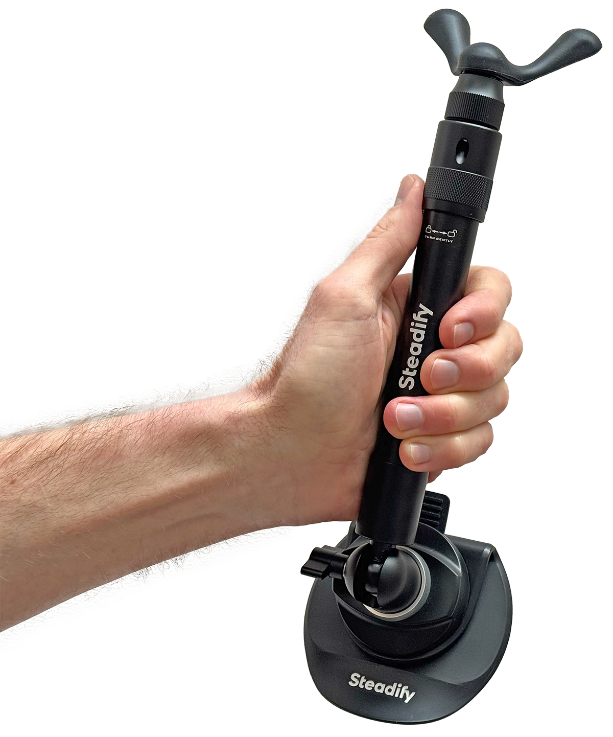 Hand holding the Steadify base plate — compact, magnetic camera support