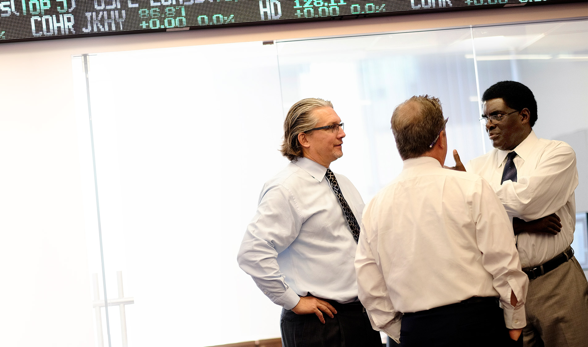 A meeting between three William O'Neil Directors.