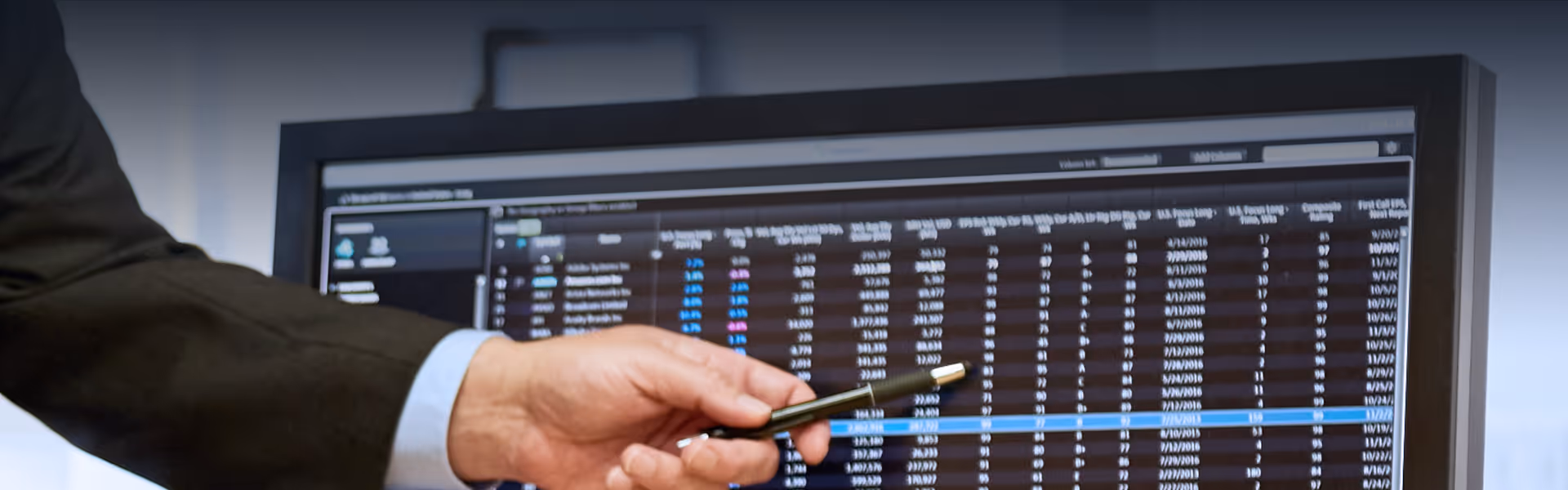 An image of someone pointing out elements on a computer display of Panaray's interface.