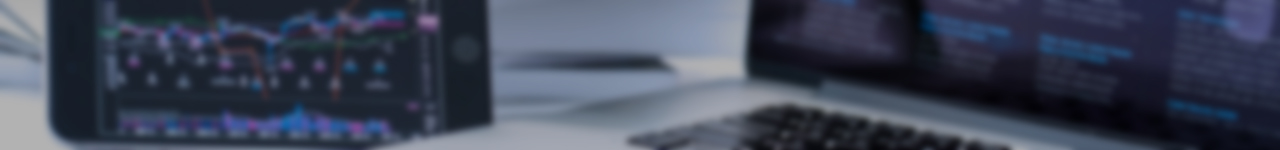 An blurry image of a iPhone and a laptop with their displaying the Panaray application.