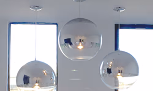An images of ceiling lights hanging in the William O'Neil San Francisco Offices.