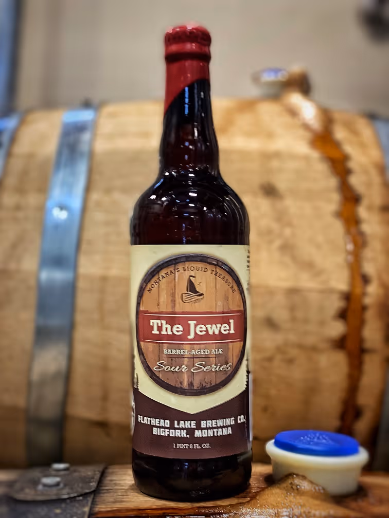 Tall brown bottle of "The Jewel" barrel-aged ale from Flathead Lake Brewing Co.