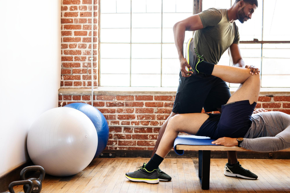 Anatomical diagram showing hip joint conditions treated with physical therapy including hip labral tears, bursitis, and arthritis at Centennial clinic