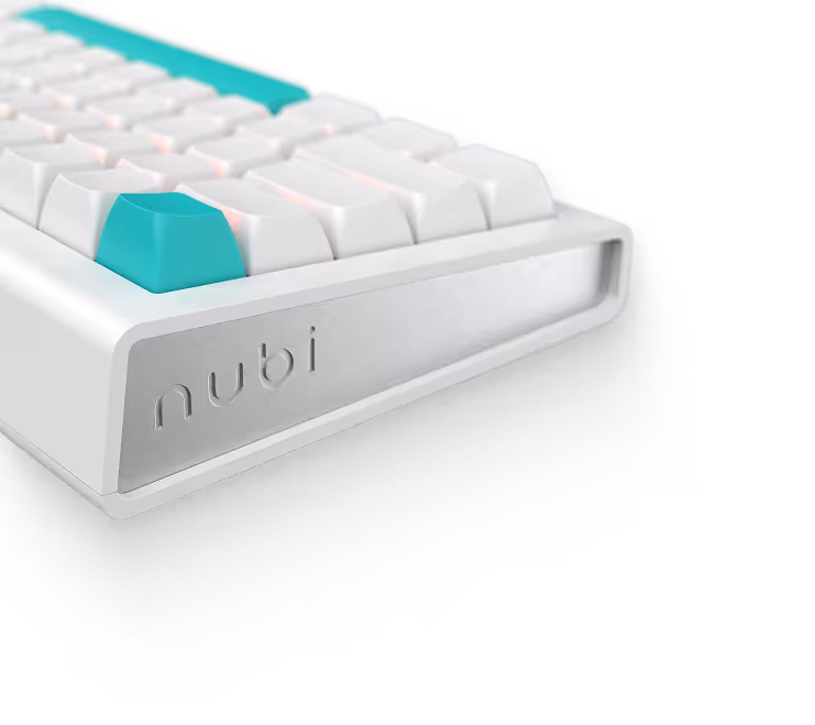 Close-up of a white mechanical keyboard corner with teal keycaps and the brand name 'nubi' engraved on the side.