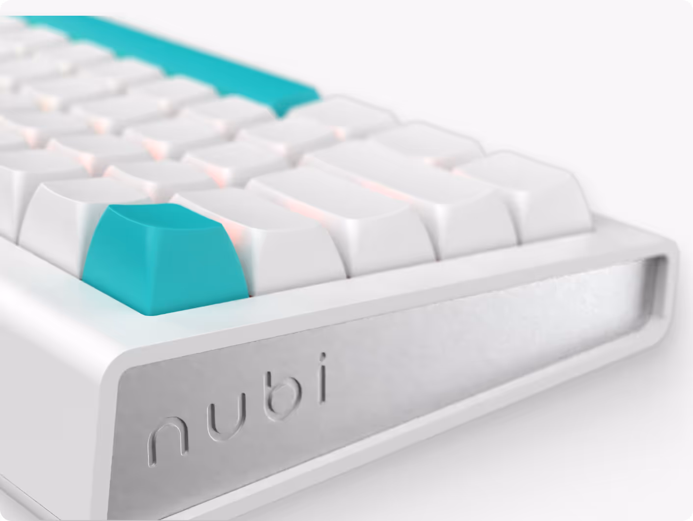 Close-up of a white mechanical keyboard with turquoise keycaps and 'nubi' engraved on the frame.