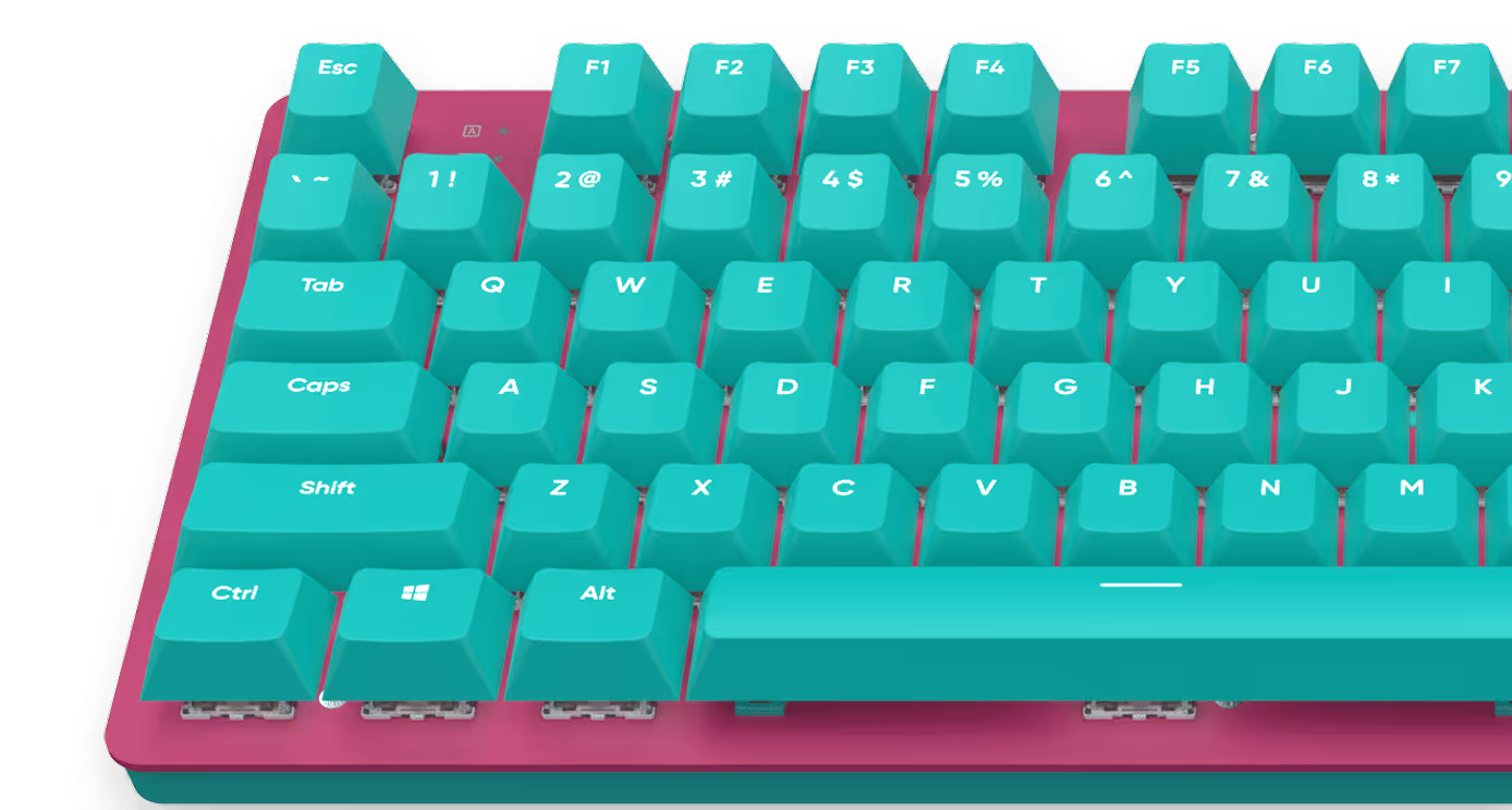 Partial view of a mechanical keyboard with turquoise keycaps and a magenta baseplate.