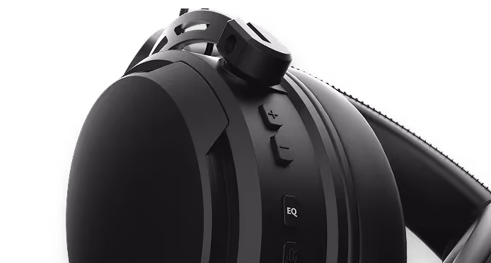 Close-up of black over-ear headphones showing ear cup with EQ and control buttons.