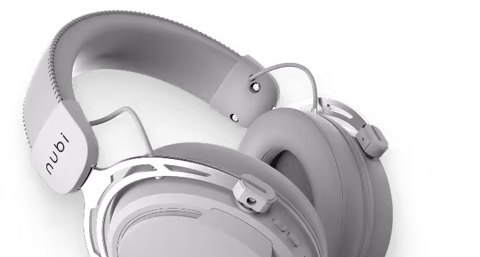 Close-up of modern gray over-ear headphones with cushioned ear pads and adjustable headband labeled 'nubi'.