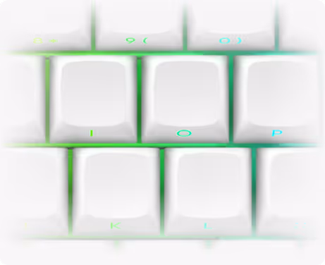 Close-up of white keyboard keys I, O, P, K, and L with green backlighting.