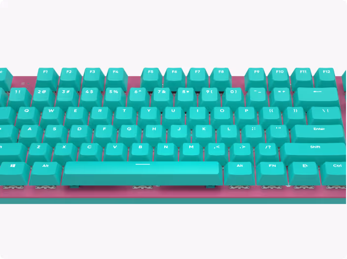 Compact mechanical keyboard with teal keycaps on a pink base.