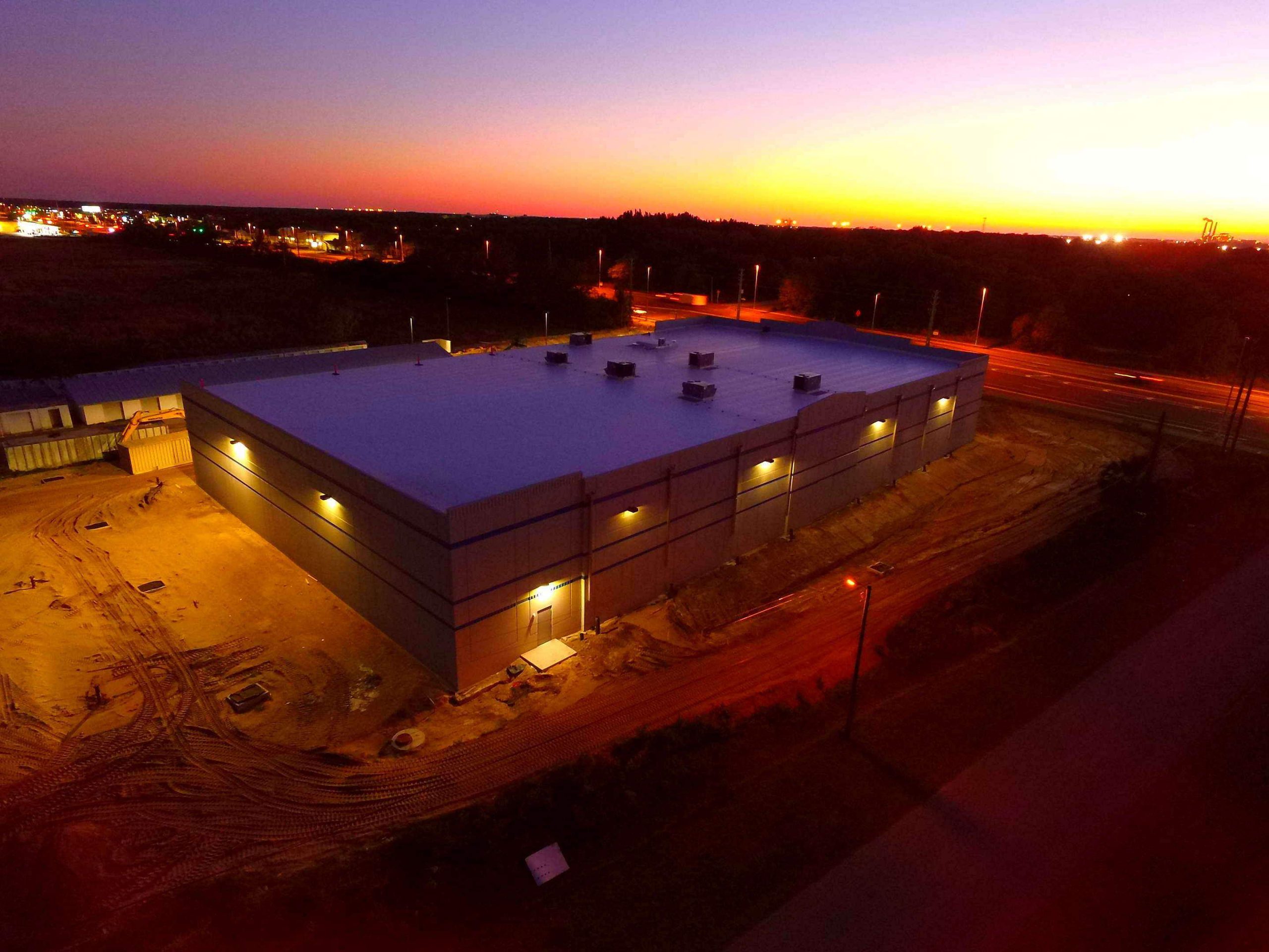Commercial roof building photographed at sunset