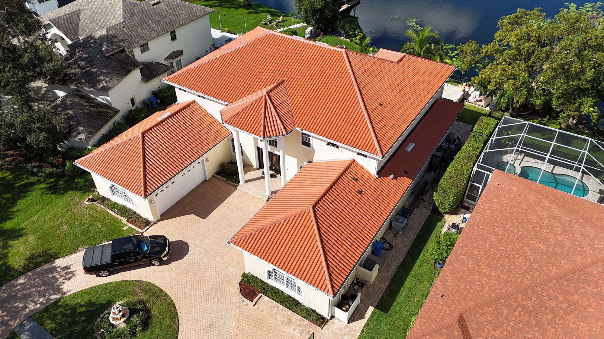 Installation of new asphalt shingle roof showing proper ventilation and flashing