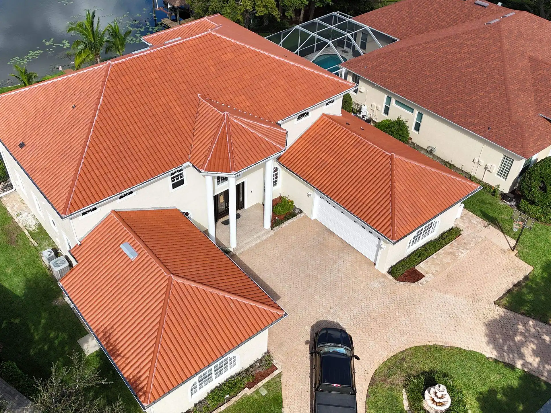Roofing company Tampa installing durable metal roofing on residential home