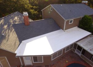 Flat roof installation on Florida home with shingle roof combination
