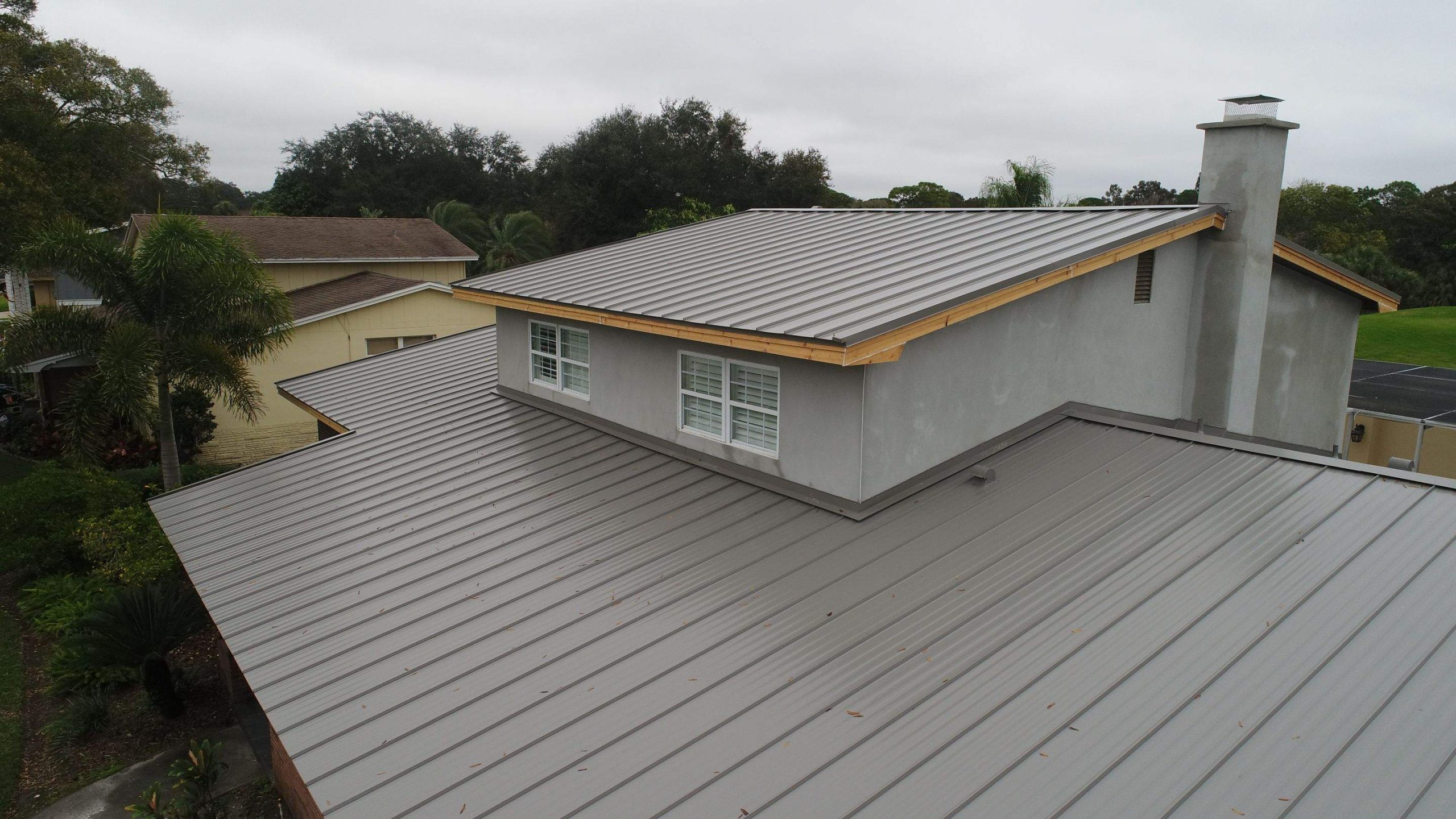 residential roofing Tampa team repairing storm-damaged home roof