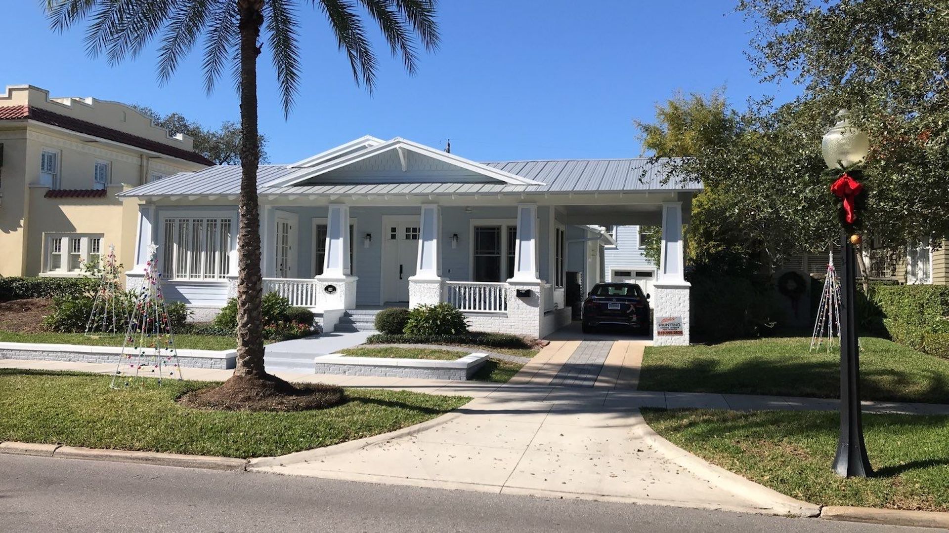 stately white home with new roof installed by roofing company Tampa