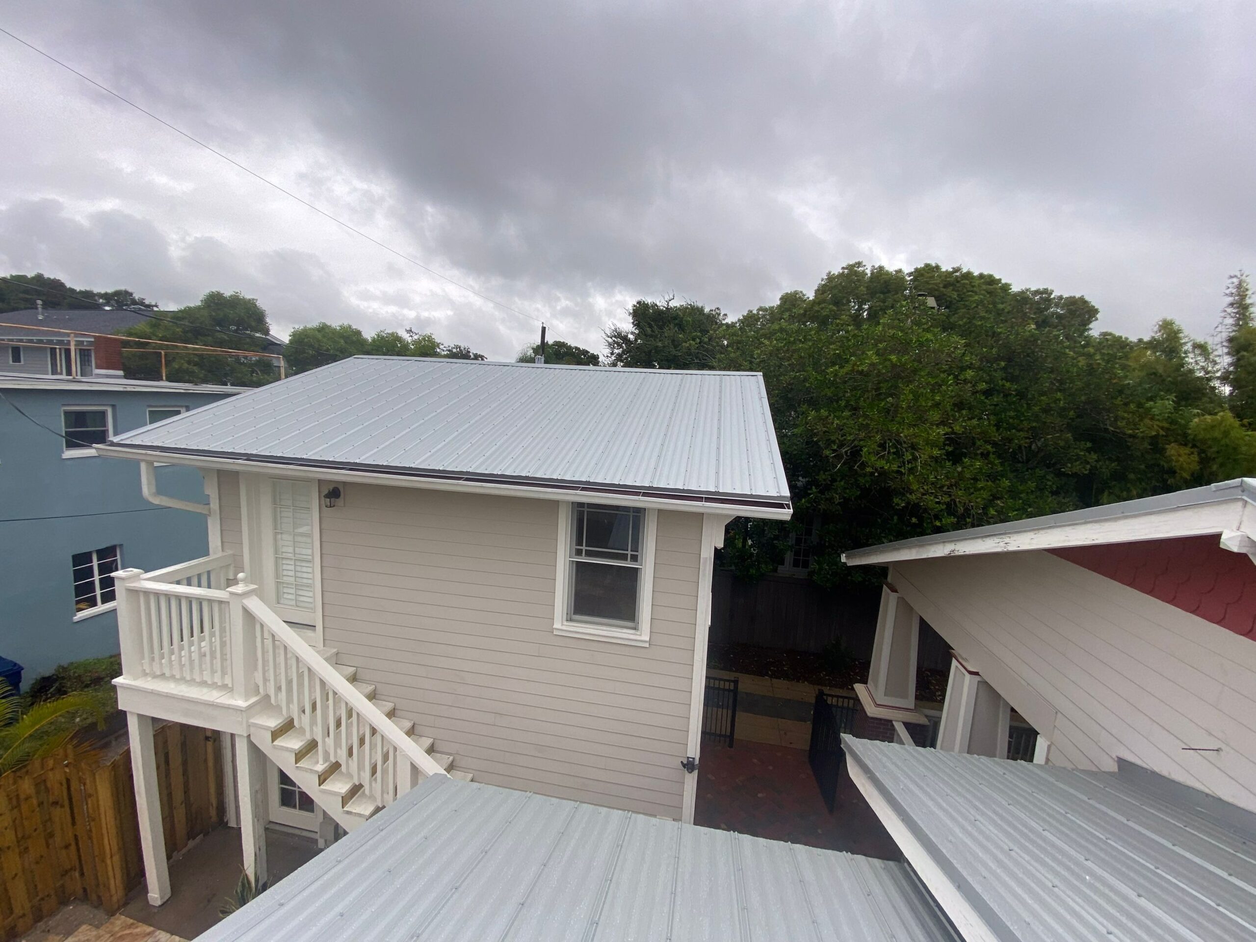 residential home with new shingle roof by Tampa roofing company