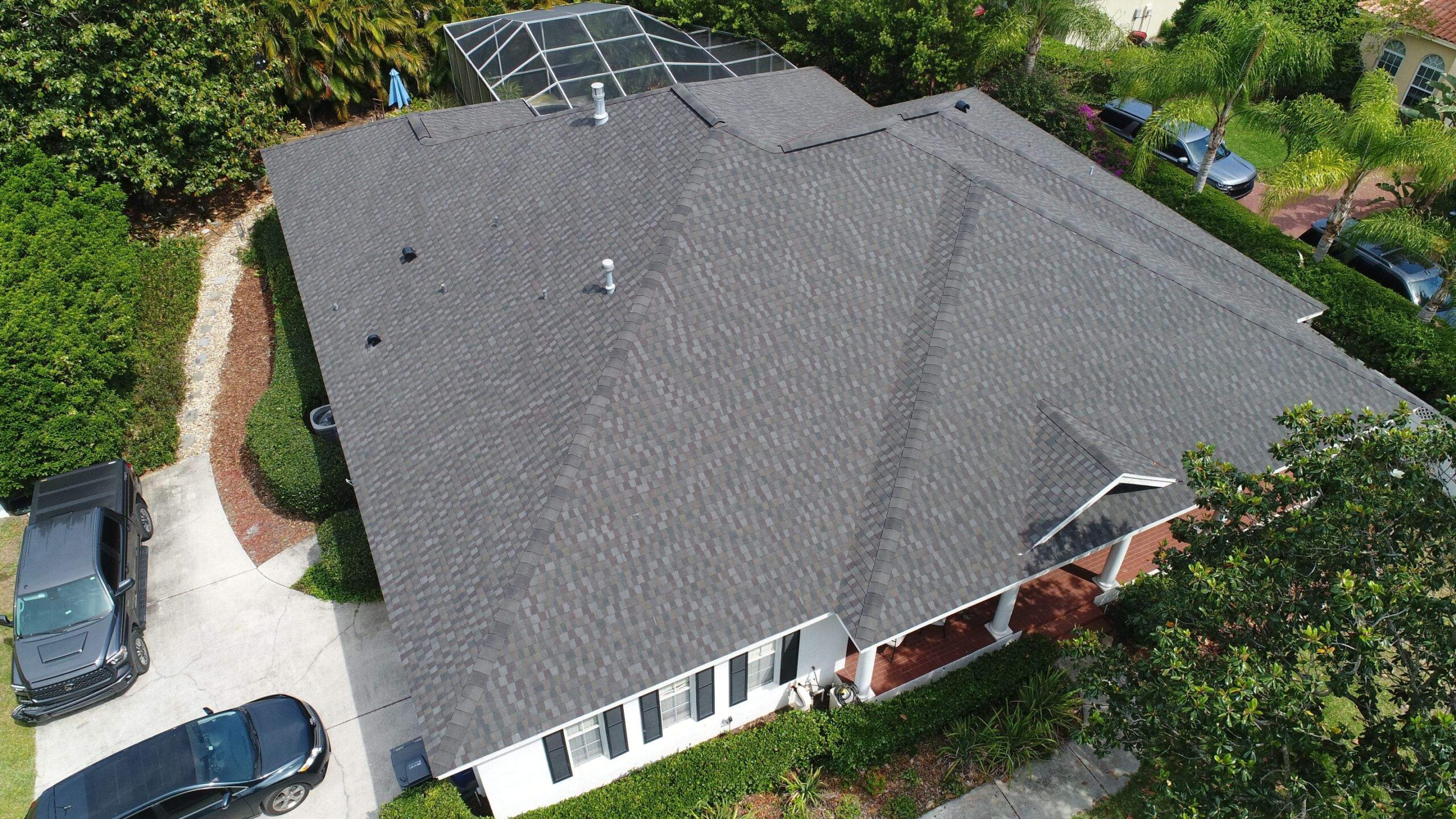 Tampa roofing company replacing roof shingles on residential home