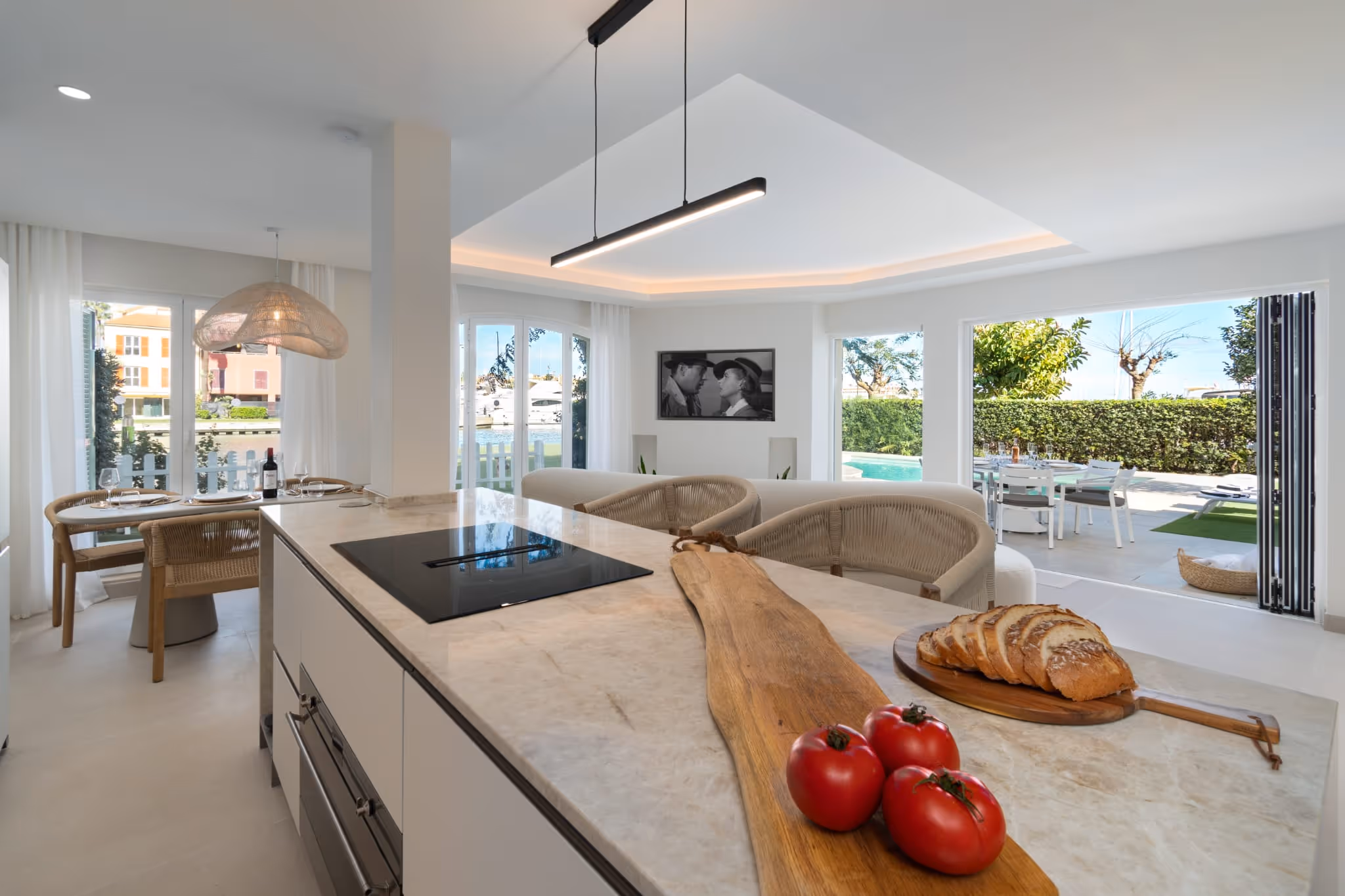 Open-plan kitchen and dining area with island and garden views