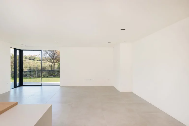 Bright open-plan living area with sliding glass doors to the garden