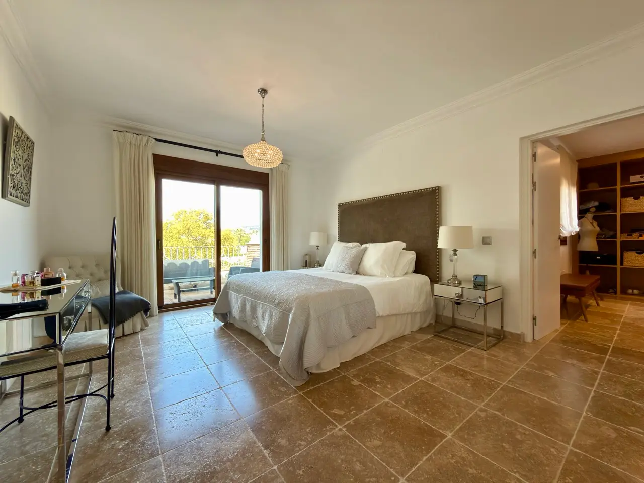 Bedroom with double bed, terrace doors and built-in wardrobe access