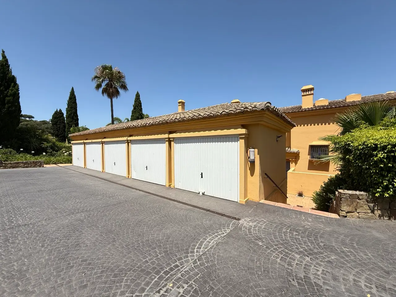 Row of private garages in the Los Carmenes community