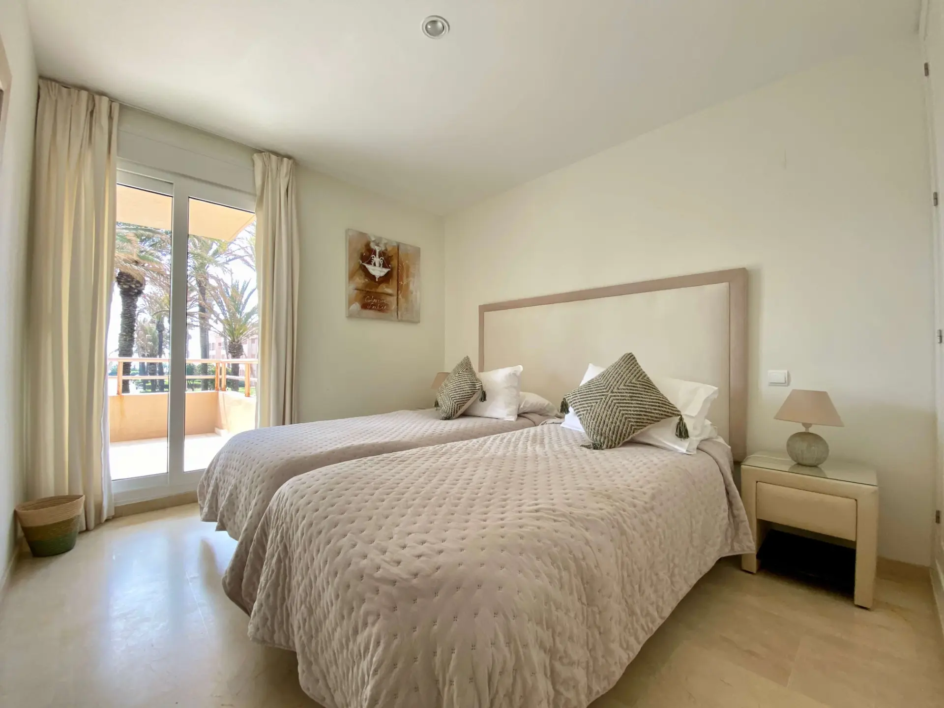 Bedroom with double bed, terrace doors and soft natural light