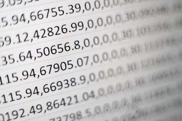 image of hands typing on a laptop with scientific data