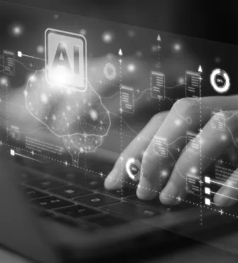 Person typing on a keyboard with a digital overlay of AI-related icons, charts, and a neural network graphic.