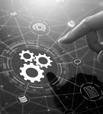 Finger touching digital interface with interconnected icons including gears, a document, and user symbols, representing technology and integration.