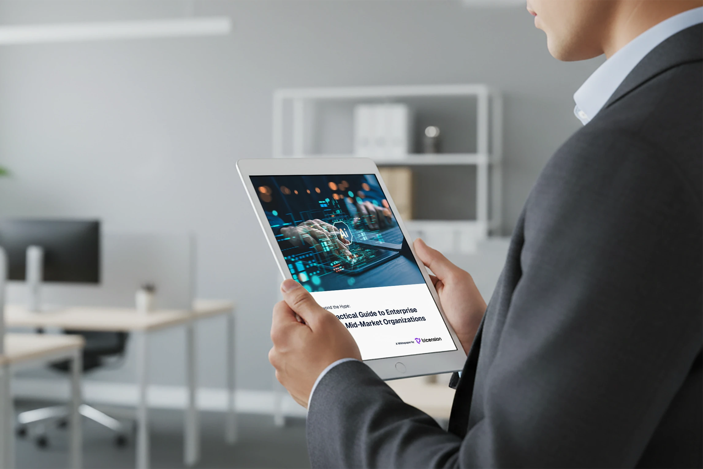 Person in business attire holding a tablet displaying a whitepaper titled 'Practical Guide to Enterprise Mid-Market Organizations' with AI-themed graphics.