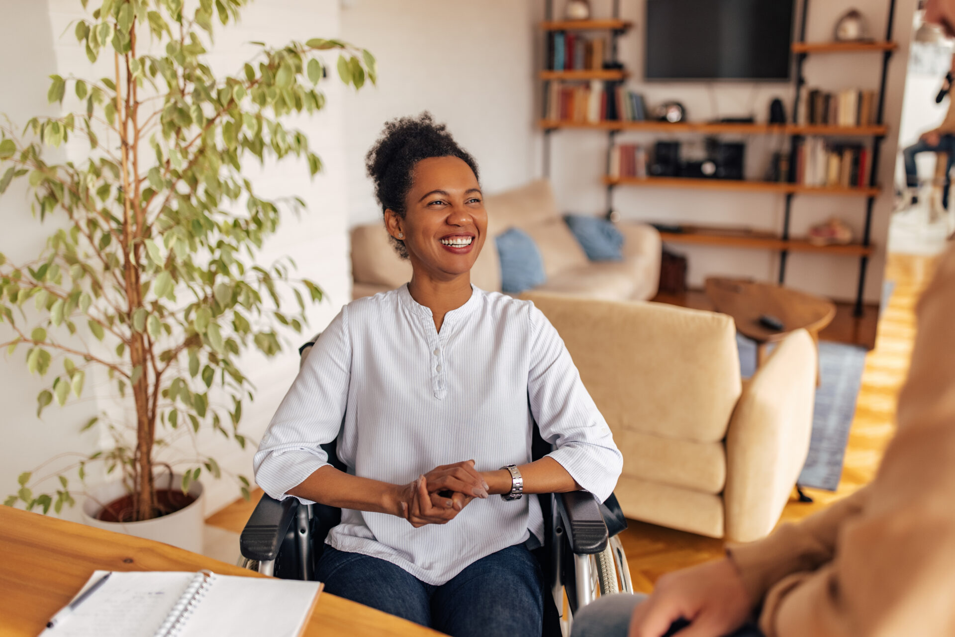Woman smiling in a wheelchair