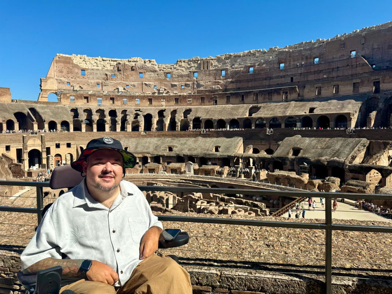 A man named Spencer in a wheelchair posing in Rome