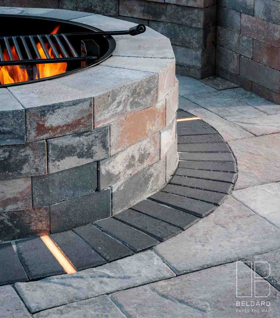 modern linear fireplace and rustic circular fire pit - how fire features enhance outdoor living spaces