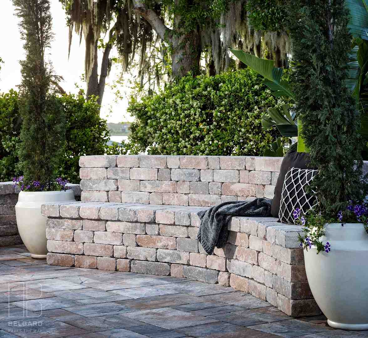 multi-level paver patio with integrated retaining walls and planters - how to create outdoor living space