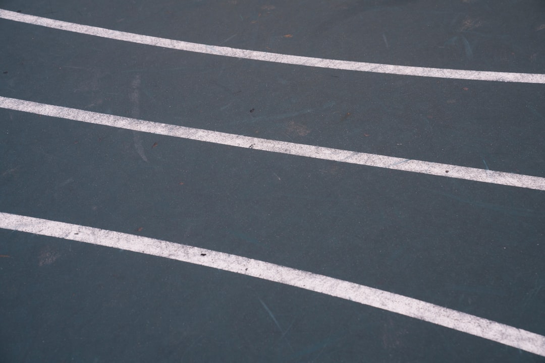 clean, well-maintained parking lot with clear line striping - repair paving