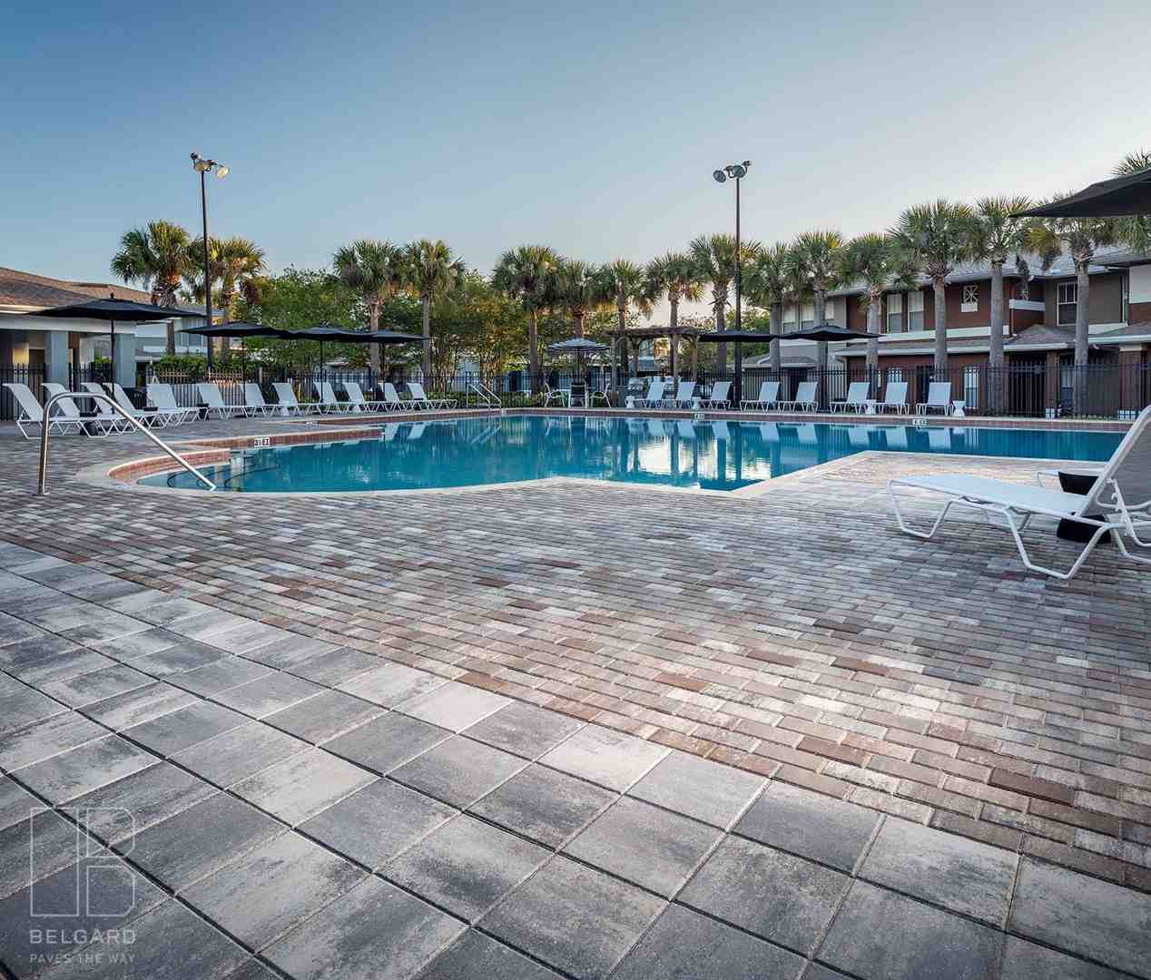 heat-resistant pavers next to a pool - residential poolside paving sanford