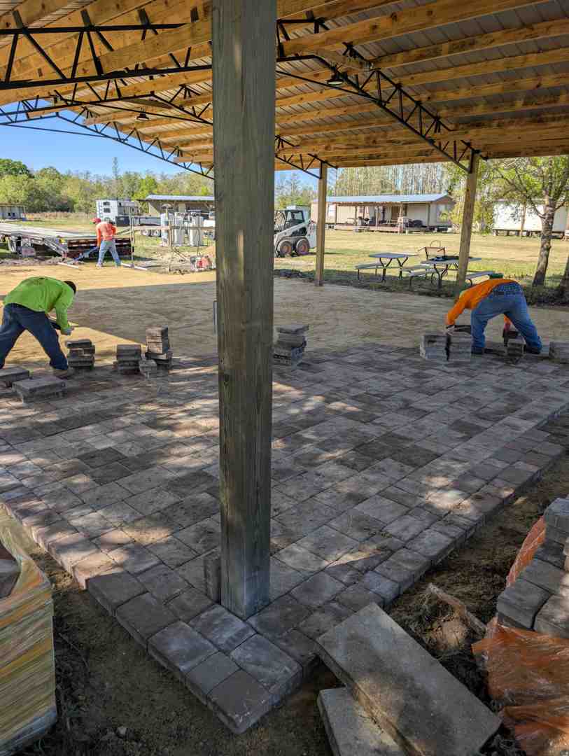 professional applying paver sealer with a sprayer - should you seal pavers in florida professional applying paver sealer with a sprayer - should you seal pavers in florida