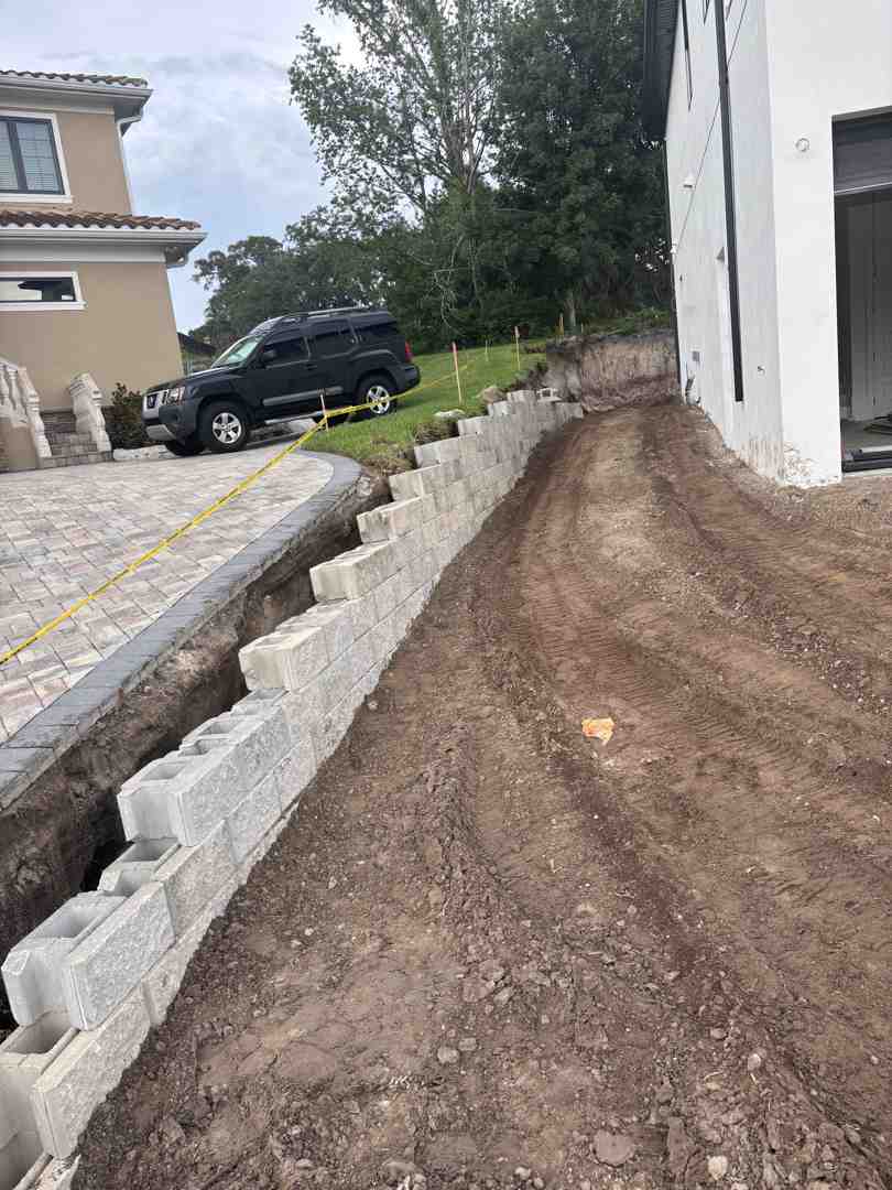 tiered retaining wall system on a sloped commercial property - commercial hardscaping in mount dora, fl